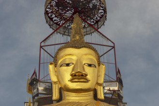 32 metre high standing Buddha decorated with glass mosaics and 24 carat gold, the upper knot of the