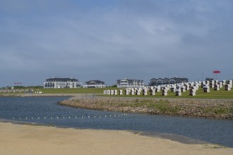 Beach chairs on the family lagoon, Perlebucht, Büsum, North Sea, Schleswig-Holstein, Germany