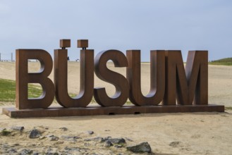 Font with capital letters BÜSUM, sign on the beach, Büsum, North Sea, Schleswig-Holstein, Germany