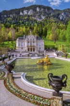 Water parterre with flora fountain and the portal of Linderhof Castle in spring, municipality of