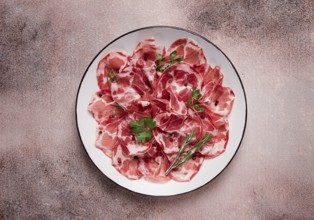 Sliced cured ham, prosciutto, italian dish, delicacy, parma ham, top view, no people