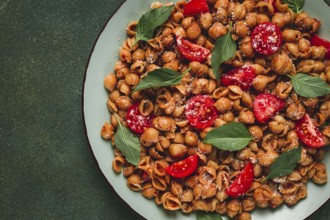 Tuscan pasta with smoked paprika and basil, parmesan cheese, Italian traditional cuisine