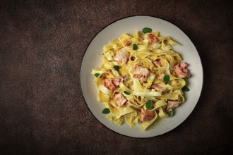 Tagliatelle pasta, in cream sauce with salmon, homemade, no people