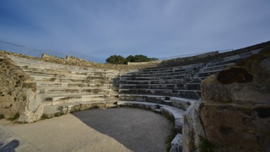 ©Udo Rein, Stone amphitheatre with rows of seats and open area, surrounded by ancient masonry,
