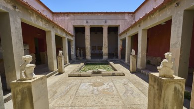 ©Udo Rein, Ancient courtyard with statues and mosaic floor between columns, water basin, Casa