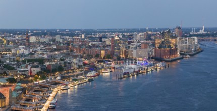 Panoramic aerial view of the Landungsbrücken in the harbour at blue hour with the Elbphilharmonie