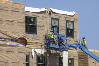 Detroit, Michigan - Workers use modular construction methods to build apartments for low to