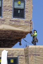 Detroit, Michigan - Workers use modular construction methods to build apartments for low to