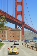 People driving vintage car, San Francisco, California, USA