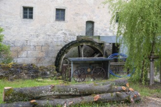 Mill wheel on a former corn mill, Großenohe, Upper Franconia, Bavaria, Germany