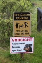 Warning signs in front of a farm, Bavaria, Germany
