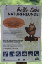 Information board at a stream dammed by beavers, Großenohe, Upper Franconia, Bavaria, Germany