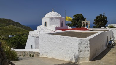 Whitewashed chapel with a view of the sea and surrounding green landscape, church, Chora, World