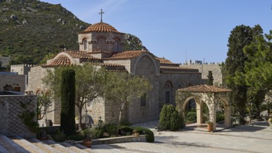 Stone church with dome in a mountainous landscape with trees, woman's monastery, Evangelismou