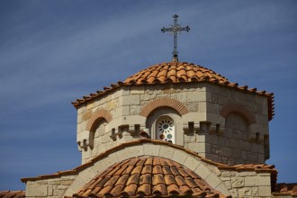Church dome with cross in front of a clear blue sky, woman's monastery, Evangelismou Monastery,