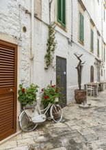 Narrow street with bicycle, Locorotondo, Apulia - Puglia, Italy