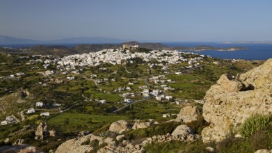 View of a village and green pastures with a distant coastline, Monastery of St John the Theologian,