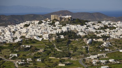 Panoramic view of a town with white houses in a green landscape, Monastery of St John the