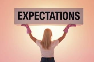 Back view of woman lifting block labeled expectations. symbolizing social pressure and gender