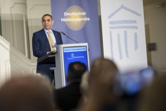 Ugur Sahin (founder of Biontech SE) gives an acceptance speech after receiving the German National