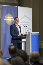 Ugur Sahin (founder of Biontech SE) gives an acceptance speech after receiving the German National