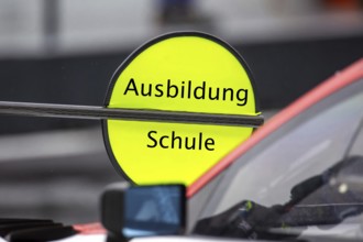 (Photomontage) Training Symbol image: Lollipop in motorsport with modified text Training / School