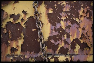 Rusty chain on an old steel wall, Bavaria, Germany