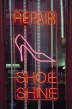 Illuminated advertising Shoe Repair in a shop, New York City, USA