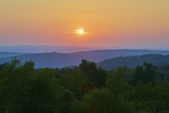 Sunset with red tones over hills and trees, quiet evening landscape, Geishöhe, Dammbach, Spessart,