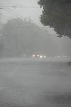 Driving a car in rainy weather, view through the windscreen, Germany