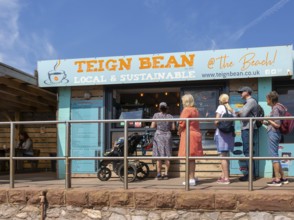 People queuing at Teign Bean cafe, Eastcliff, Teignmouth, south Devon, England, UK