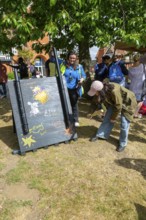 Splat the rat game at village summer fete, Bawdsey, Suffolk, England, UK