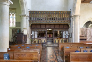 Rood screen and nave inside village parish church of Saint James, Avebury, Wiltshire, England, UK