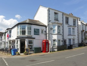 Historic buildings old red telephone box, Woody's cafe, Queen Street, Dawlish, south Devon,