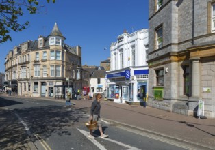 Street and shops including WH Smith in town centre of Teignmouth, south Devon, England, UK