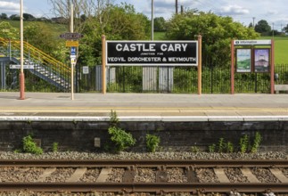 Railway station platform sign Castle Cary junction for Yeovil Dorchester and Weymouth, Somerset,
