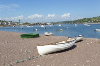 Small boats in harbour at Back Beach, Teignmouth, south Devon, England, UK view to Shaldon bridge
