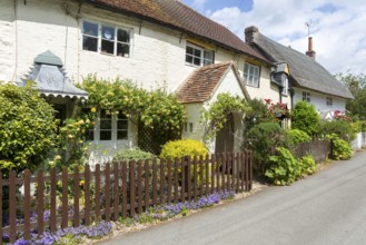 Attractive historic cottages in village of Avebury, Wiltshire, England, UK