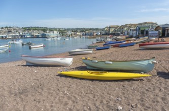 Small boats in harbour at Back Beach, Teignmouth, south Devon, England, UK