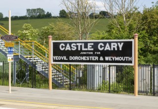 Railway station platform sign Castle Cary junction for Yeovil Dorchester and Weymouth, Somerset,