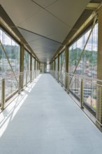 Interior view of a modern bridge with glass walls and panoramic views of the surrounding area, Zob