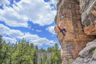 Man rock climbing at The Pit in Sandy's Canyon, Flagstaff, Arizona, USA