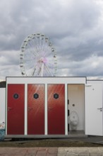 Toilets in front of the Ferris wheel at the Rock am Ring Festival on Sunday, Nürburgring race track
