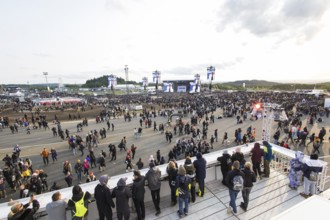 Festival-goers look at the Mandora Stage in the evening sun at the Rock am Ring Festival on Sunday,