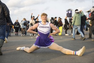 Jorik does the splits in a cheerleader outfit at the Rock am Ring Festival on Sunday, Nürburgring