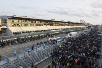 Festival visitors stream via separate entrances to the front breakwaters in front of the Utopia