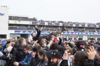 Festival visitors crowdsurfing at the Rock am Ring Festival on Friday, Nürburgring race track race