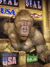 Symbolic image, Trump as KingKong, breaks through the wall for the USA, Bitcoin king, kleptocracy,