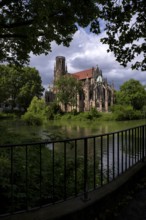 Fence in front of St John's Church, Feuersee, water is green from blue-green algae, Stuttgart-West,