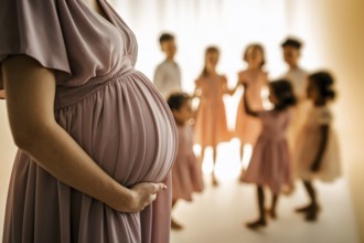 Woman with pregnant belly with many young children in blurry background, AI generated